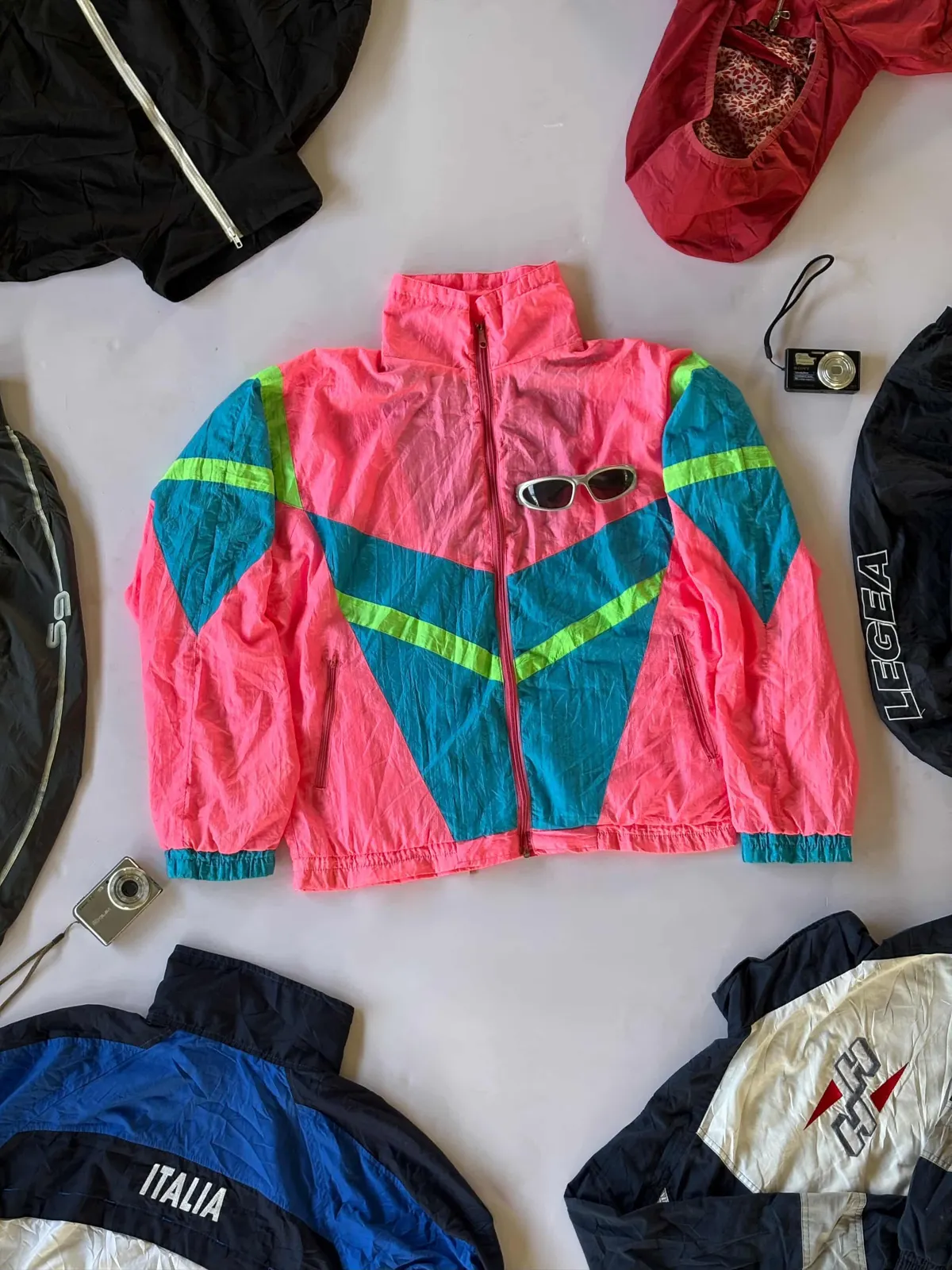 Neon Rave Shell, pink / teal / volt shell laid flat