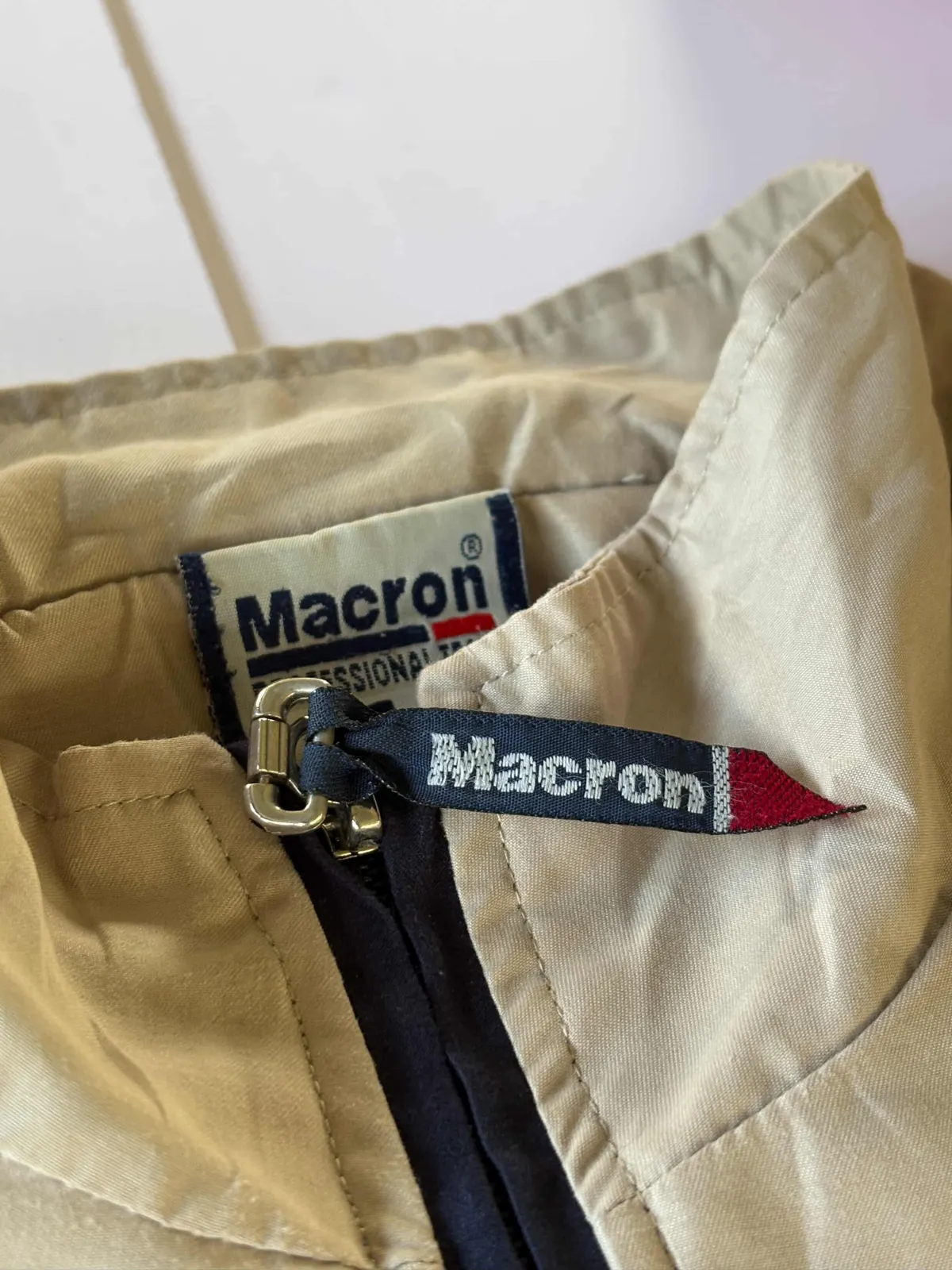 Close-up of the macron zip pull